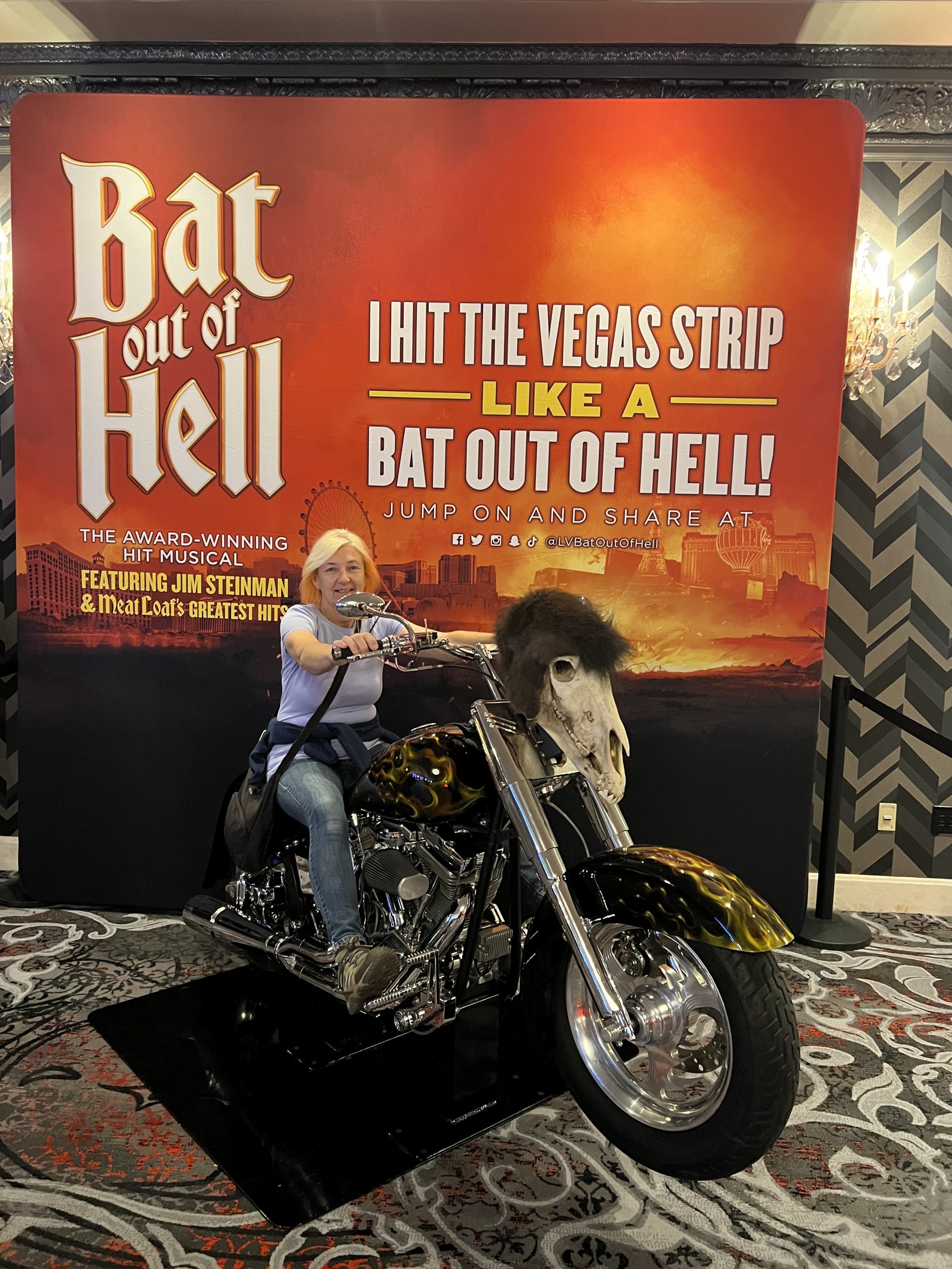 alt="me posing on a motorbike outside the Meatloaf Musical theatre"