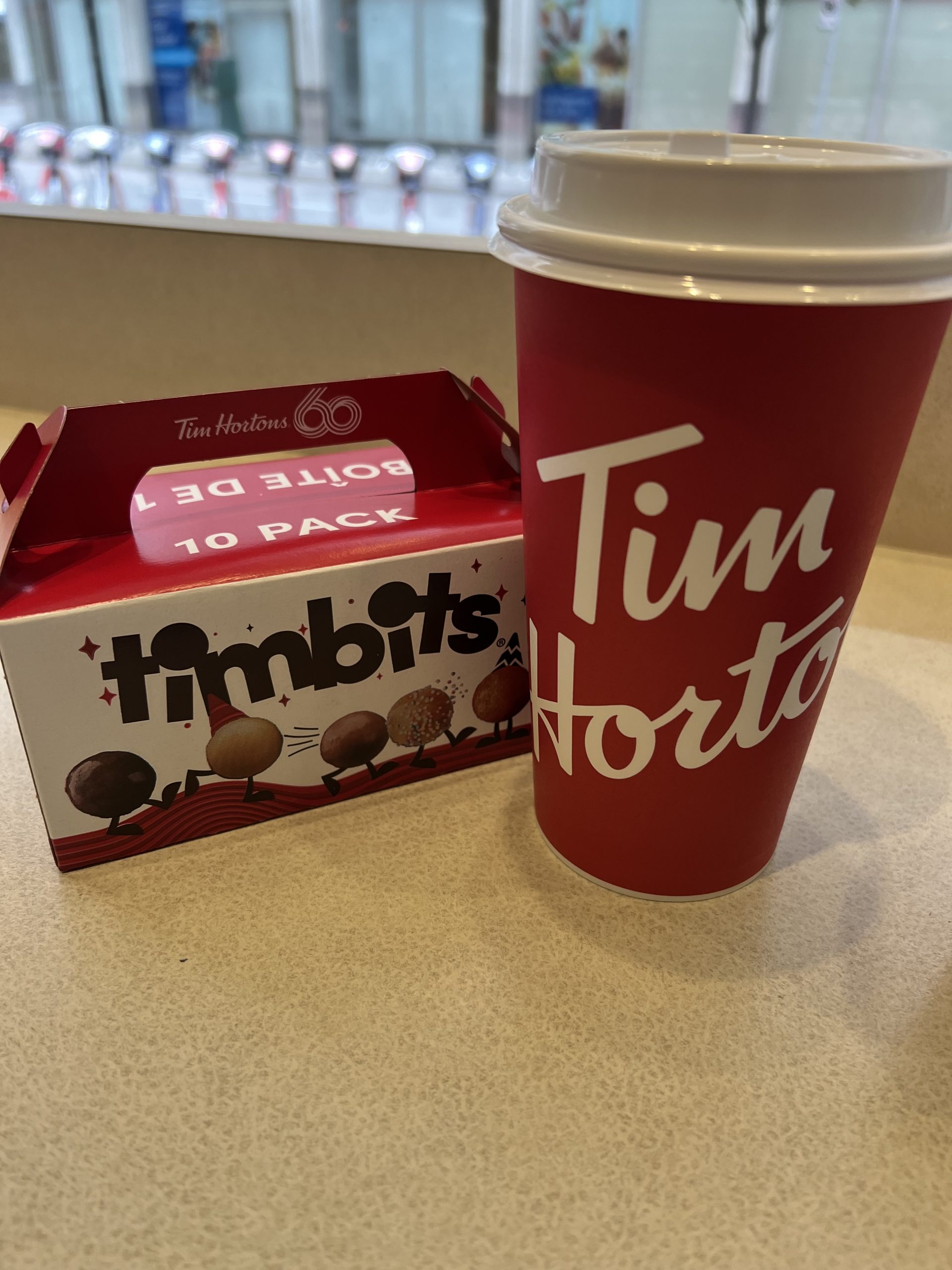 alt="box of doughnut holes & coffee"