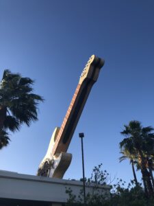 alt="guitar on top of hard rock cafe building"