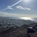 alt="view over the sea & town from the edge of the volcanic crater"