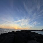 alt="a sunset over the calm sea"