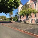 alt="side view of building with a round turret"