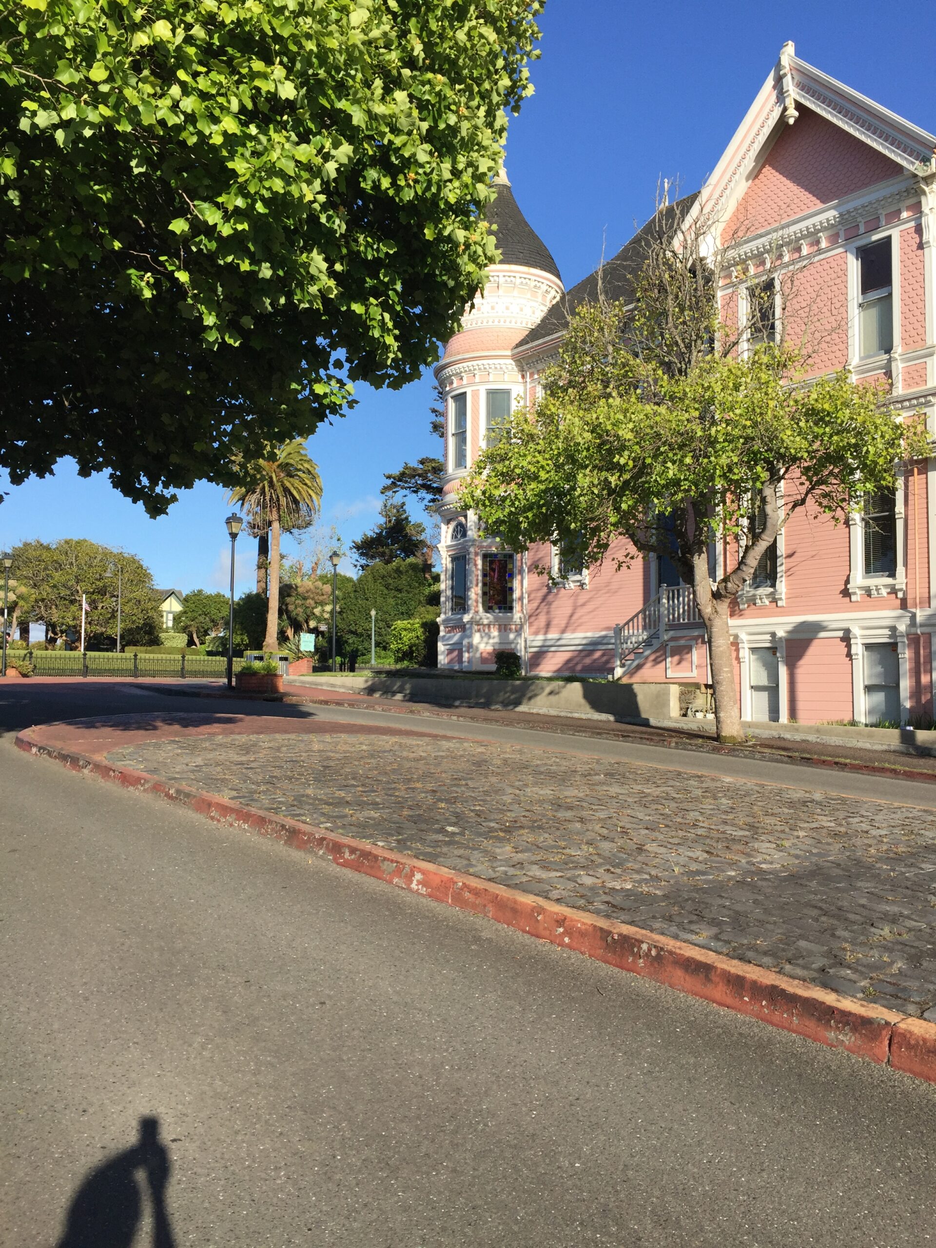 alt="side view of building with a round turret"