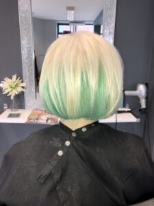 alt="head & shoulder of person at hairdressers"