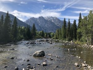 alt="river with the Tetons in background"