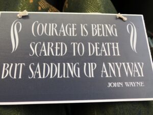 alt"courage is being scared to death but saddling up anyway"