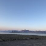 alt="sunset with lake & mountains"