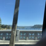 alt="from one bridge looking at another in distance across a river"