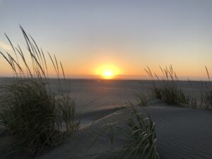 alt"sunset with sand & sea"