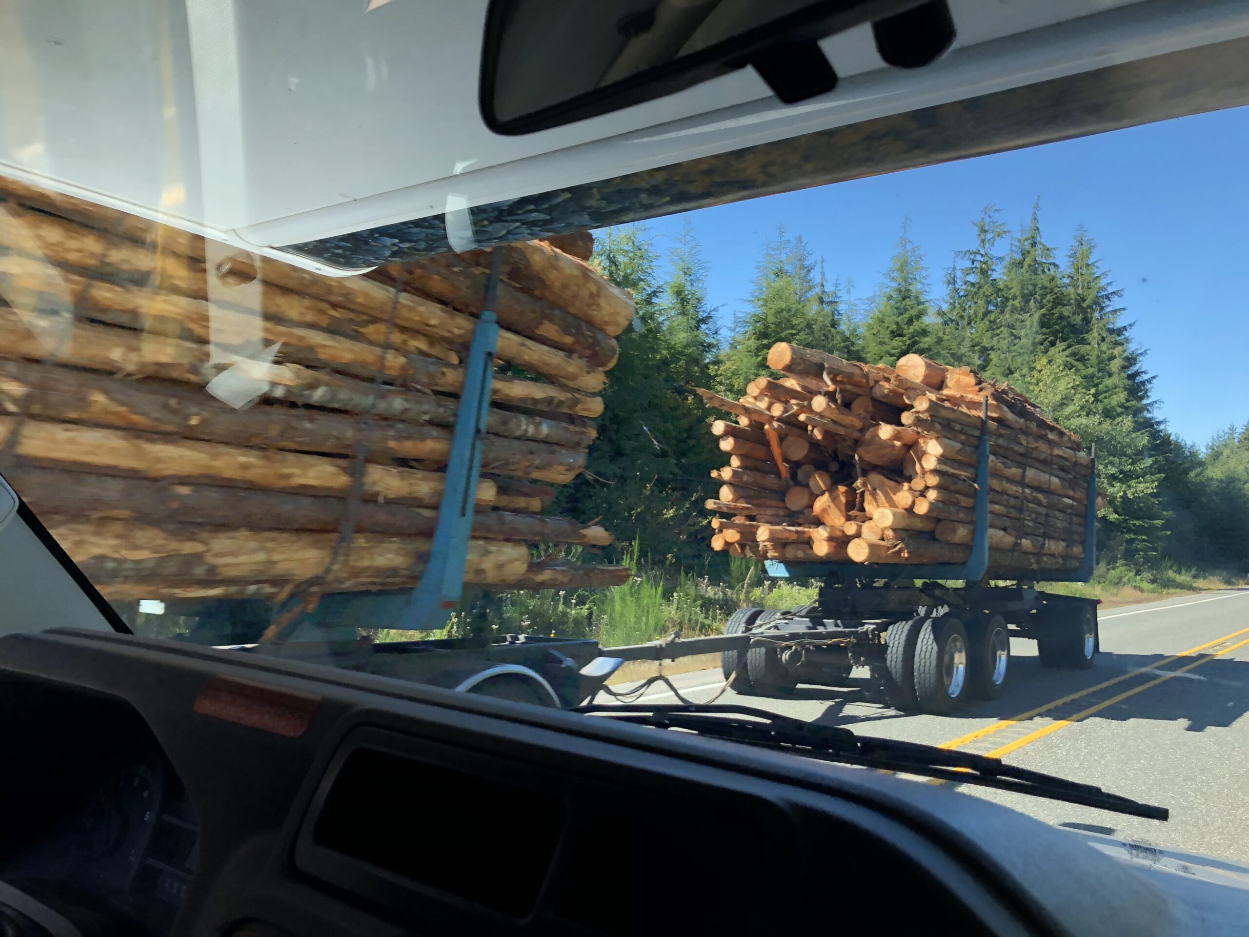 alt="passing huge logging lorry"