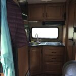 alt="inside the RV looking back towards the kitchen area"