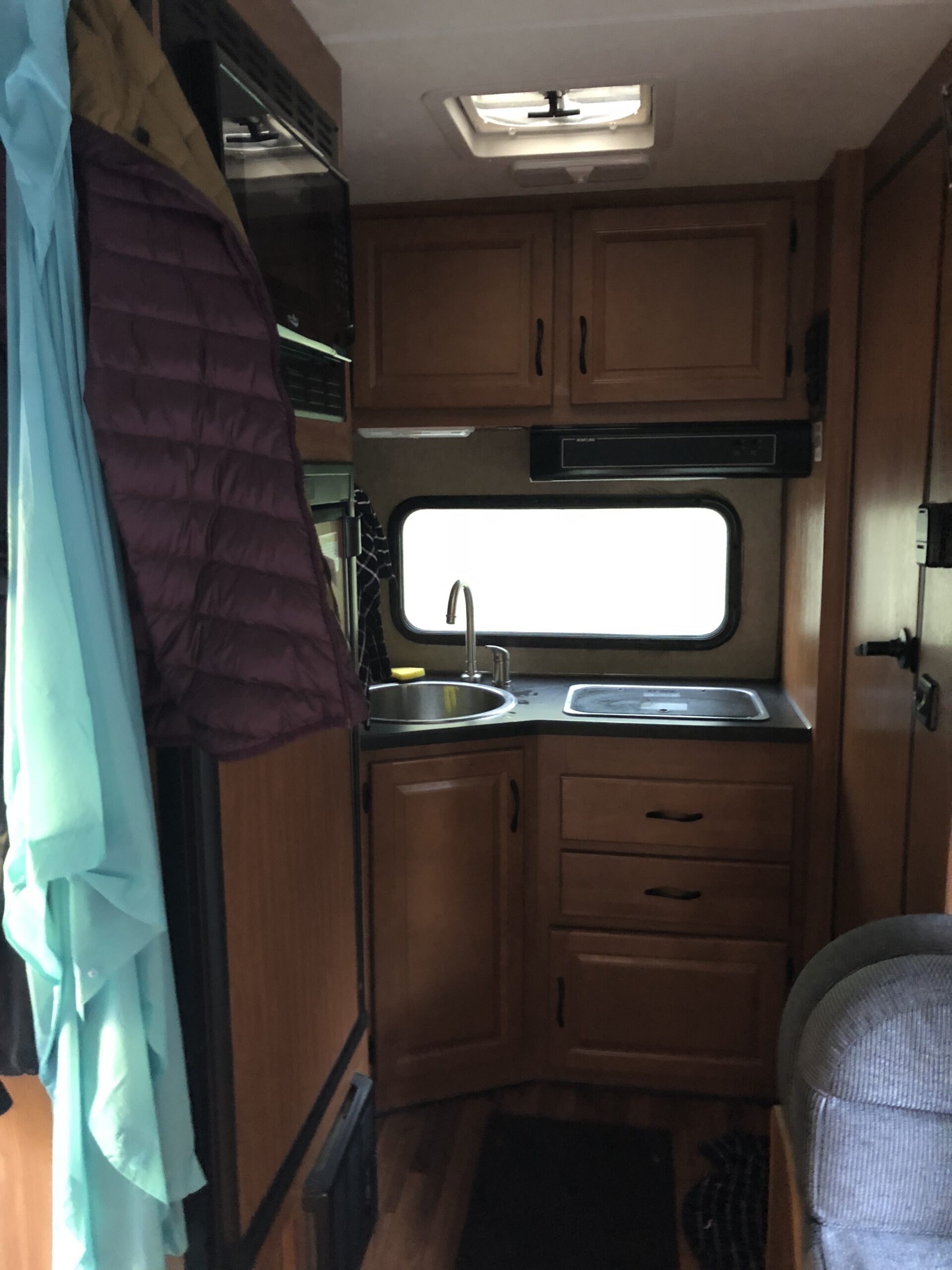 alt="inside the RV looking back towards the kitchen area"