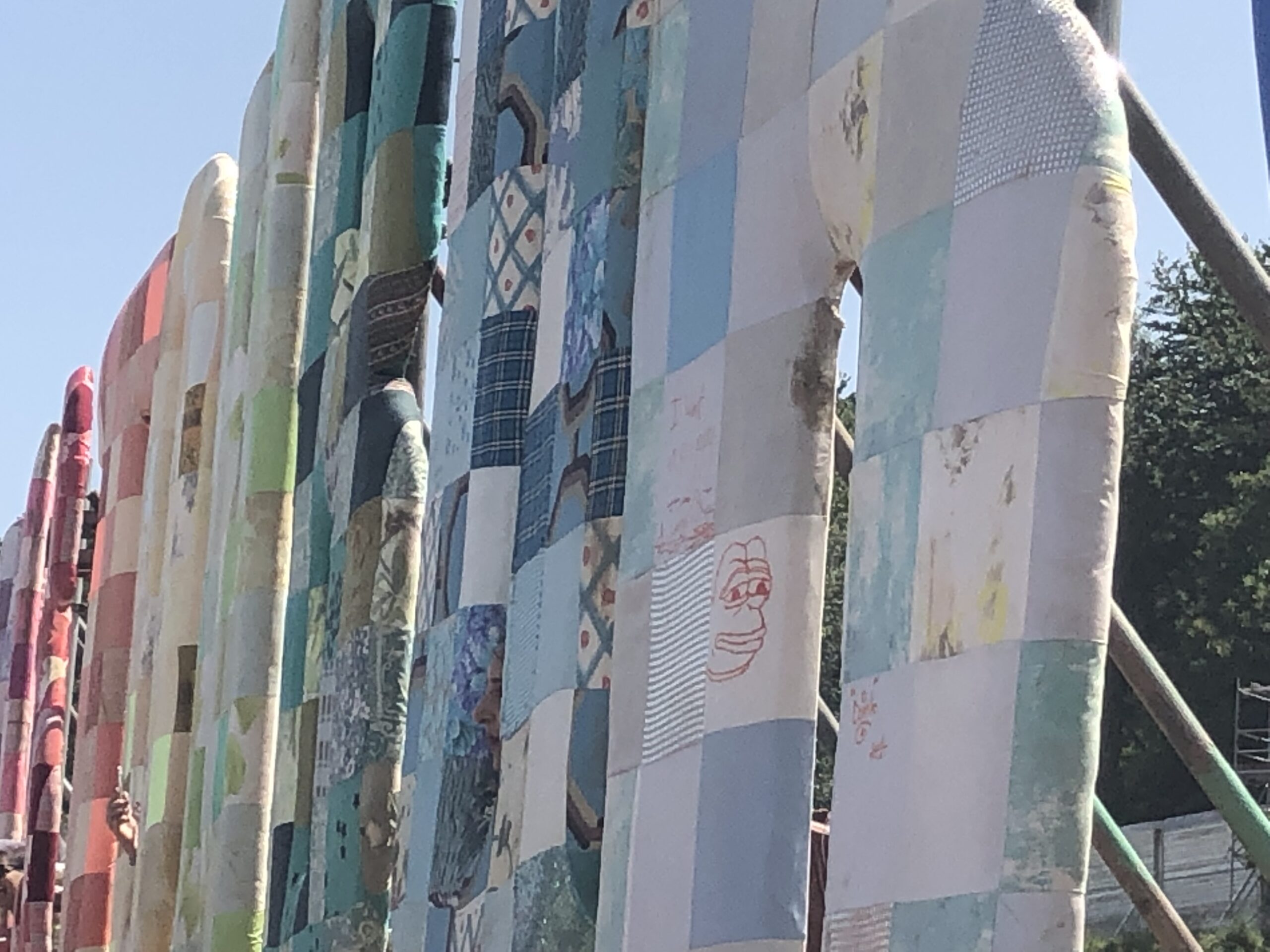 alt="close up of fabric covered letters spelling Glastonbury"