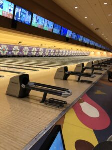 alt="inside a bowling alley"