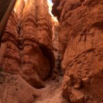 alt="narrow gap between tall rocks"