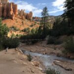 alt="river with hodos in background"