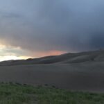 alt="sand dunes with sky & clouds"