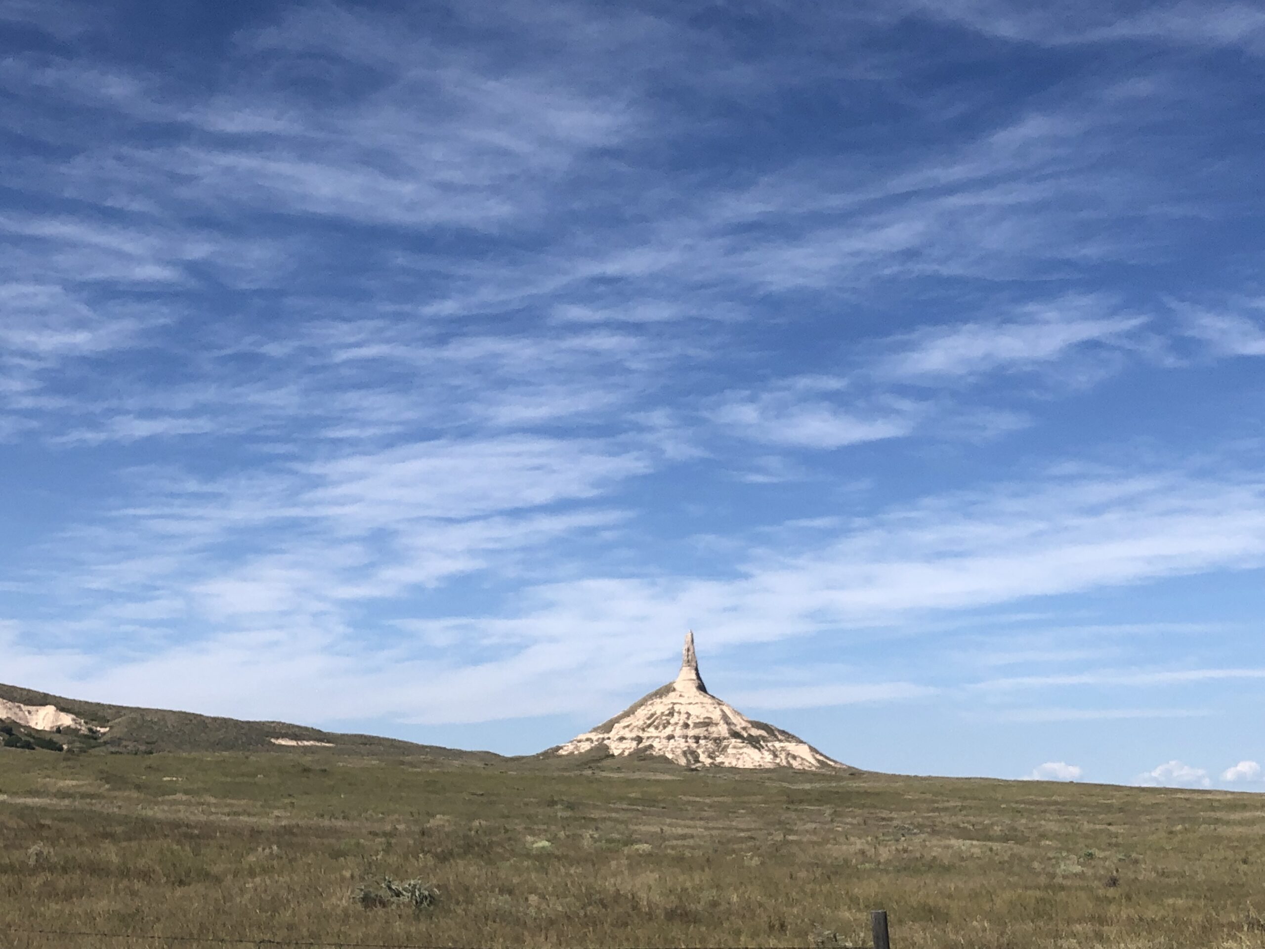 alt="scrub land with chimney stack landmark"