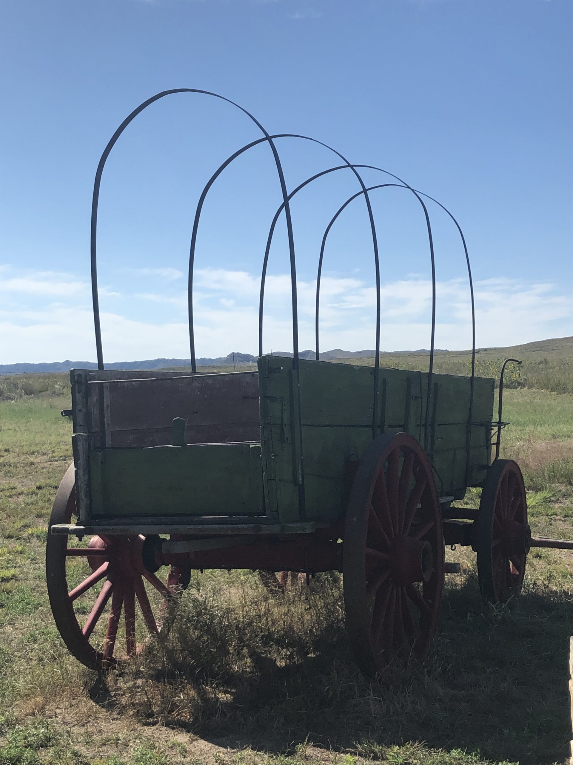 alt="old style wagon without a cover"