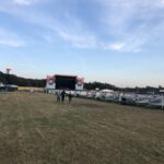 alt="filed with stage in background"