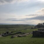 alt="looking down bank across stone ruins"