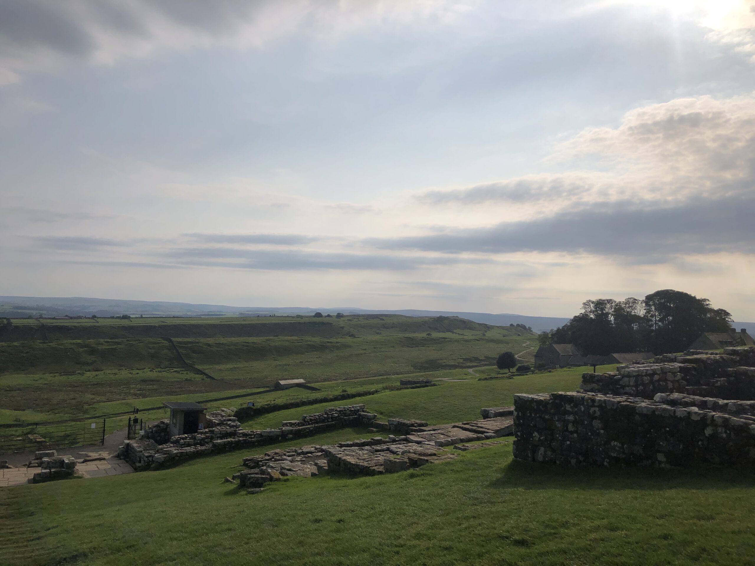 alt="looking down bank across stone ruins"
