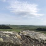 alt="looking over a stone across the fields"
