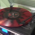 alt="record on a record player"