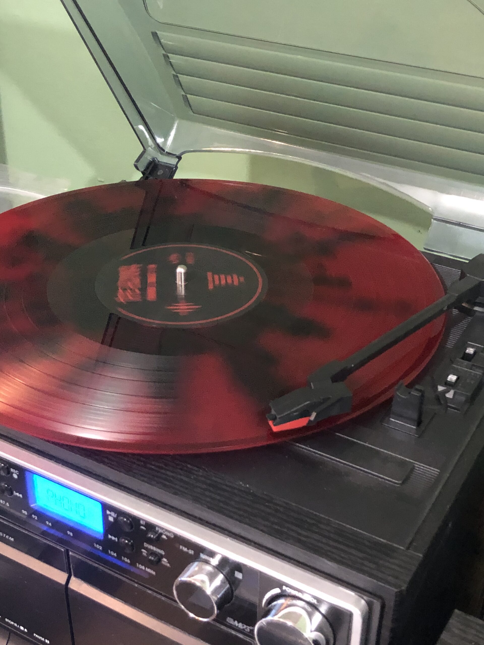 alt="record on a record player"