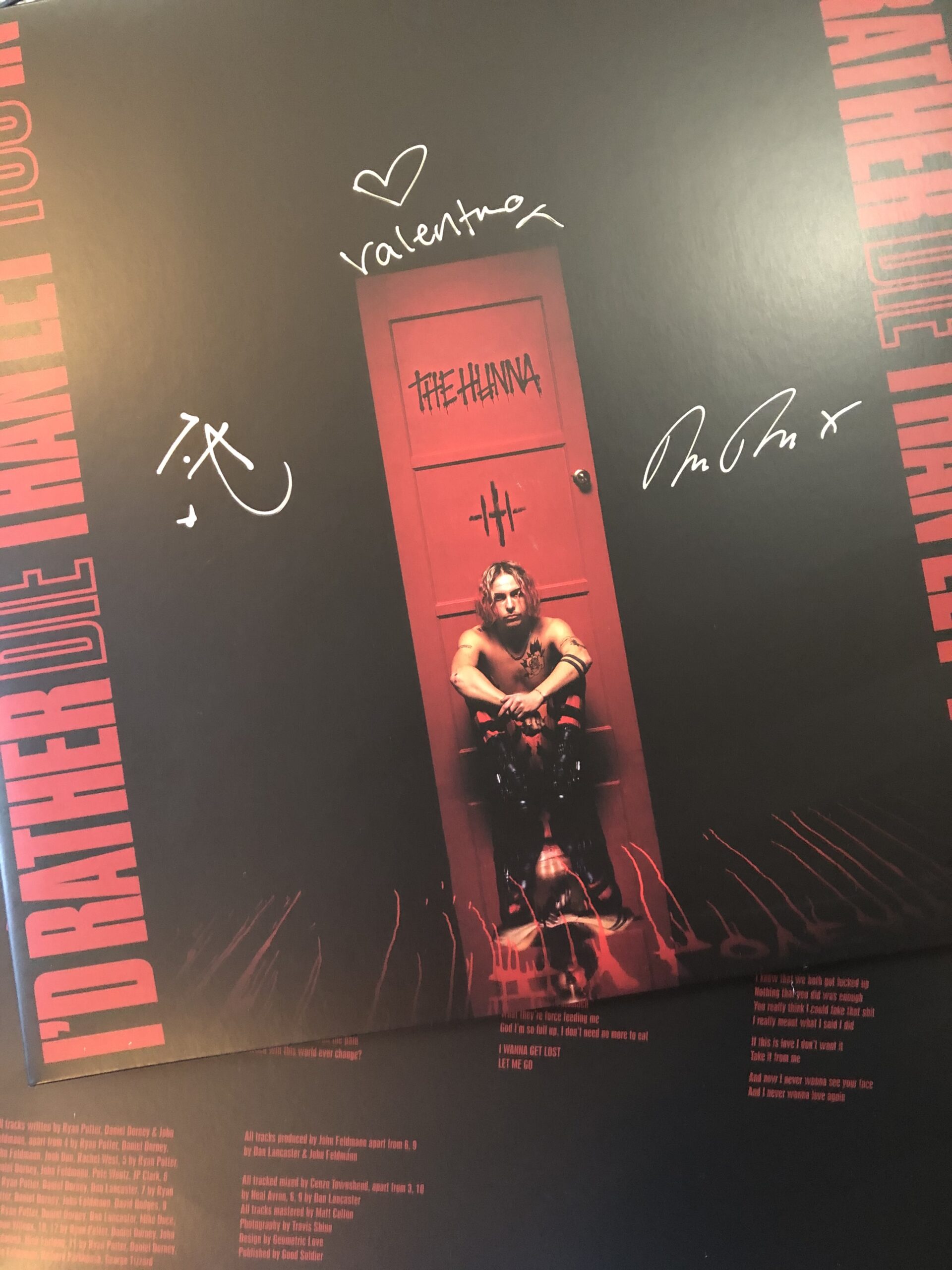 alt="album cover with person sat down"