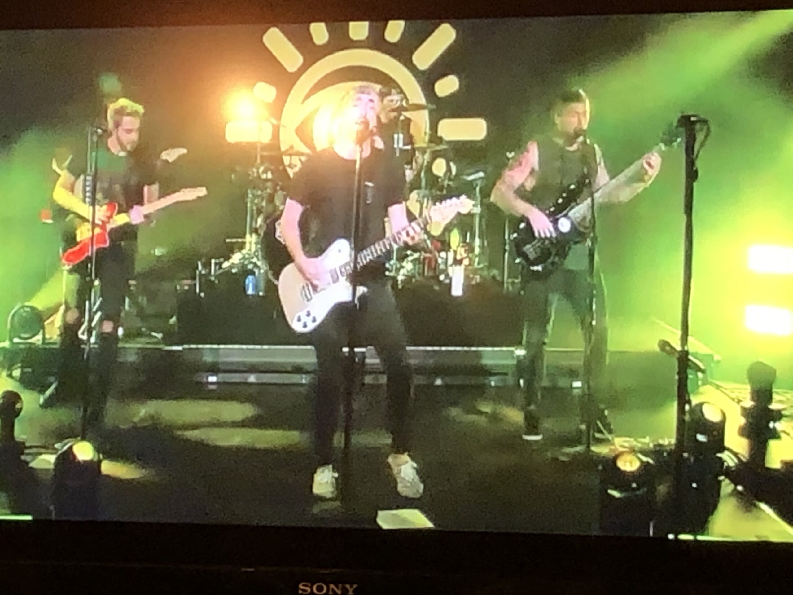 alt="the band All Time Low playing"