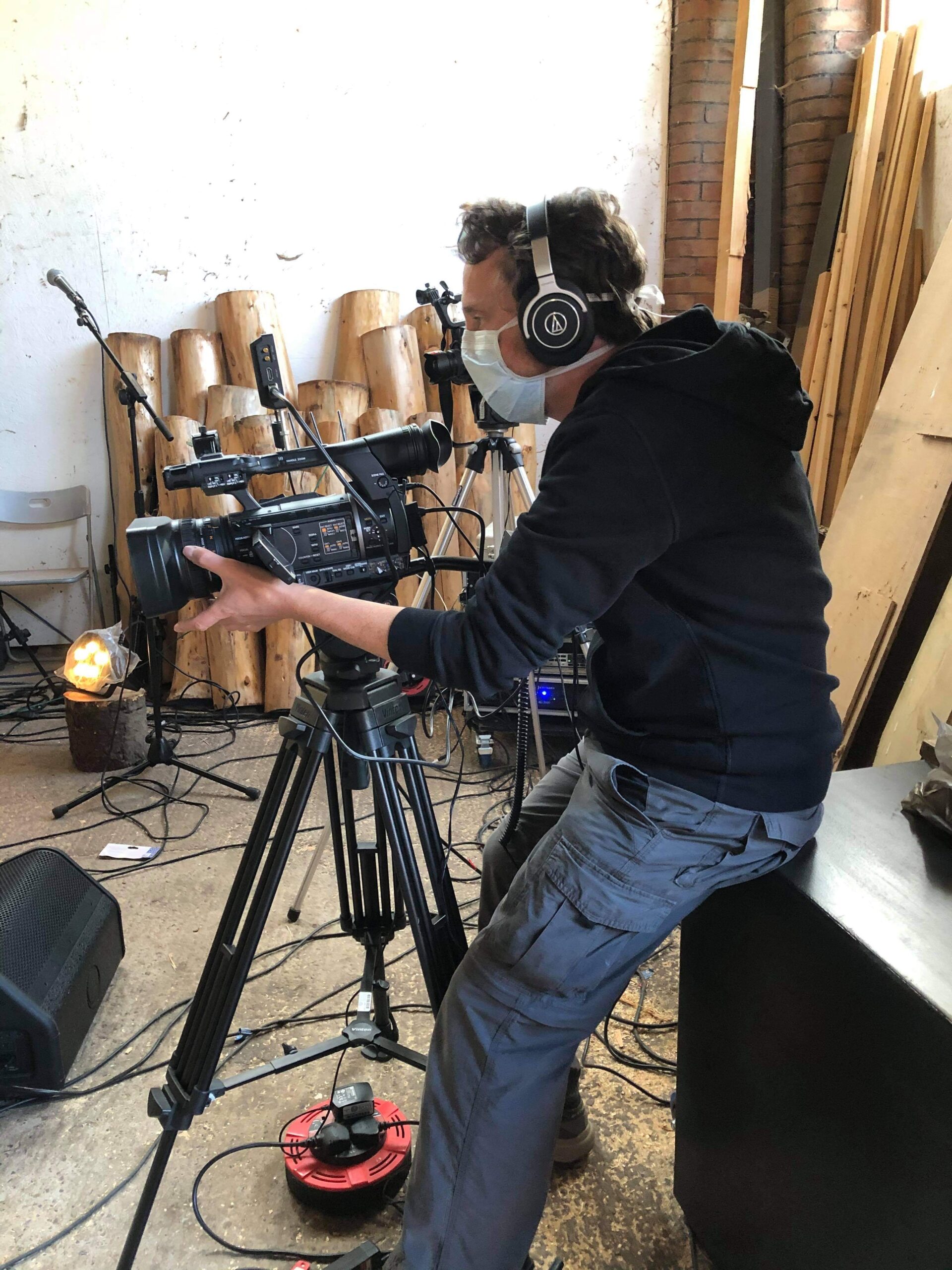 alt="person setting up camera"