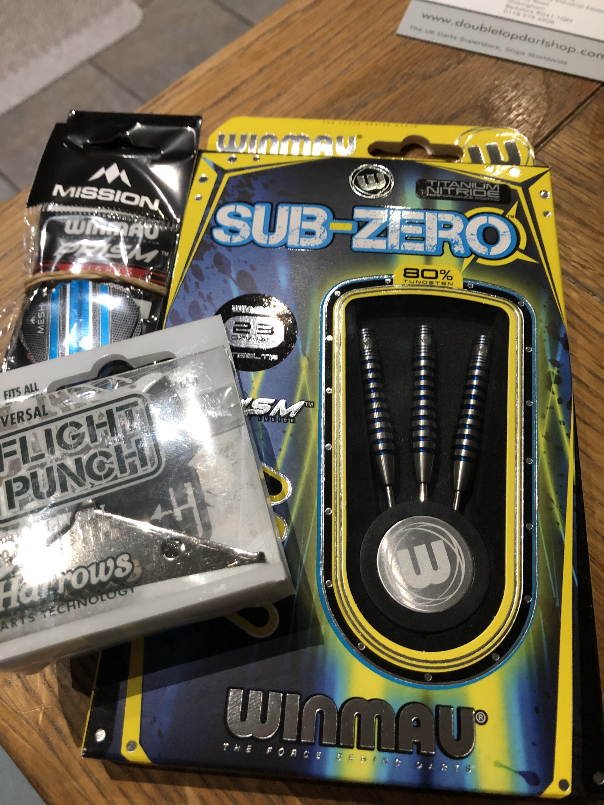alt="sets of darts in packets"