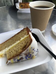 alt="piece of cake with cup of coffee"