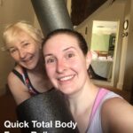 alt="two people with foam rollers"