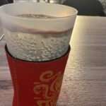 alt="glass on table with neoprene sleeve"