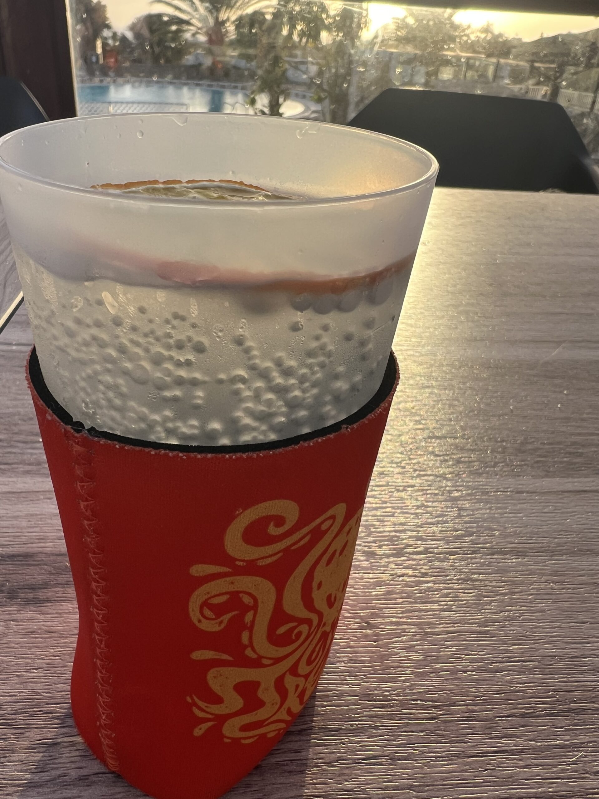 alt="glass on table with neoprene sleeve"