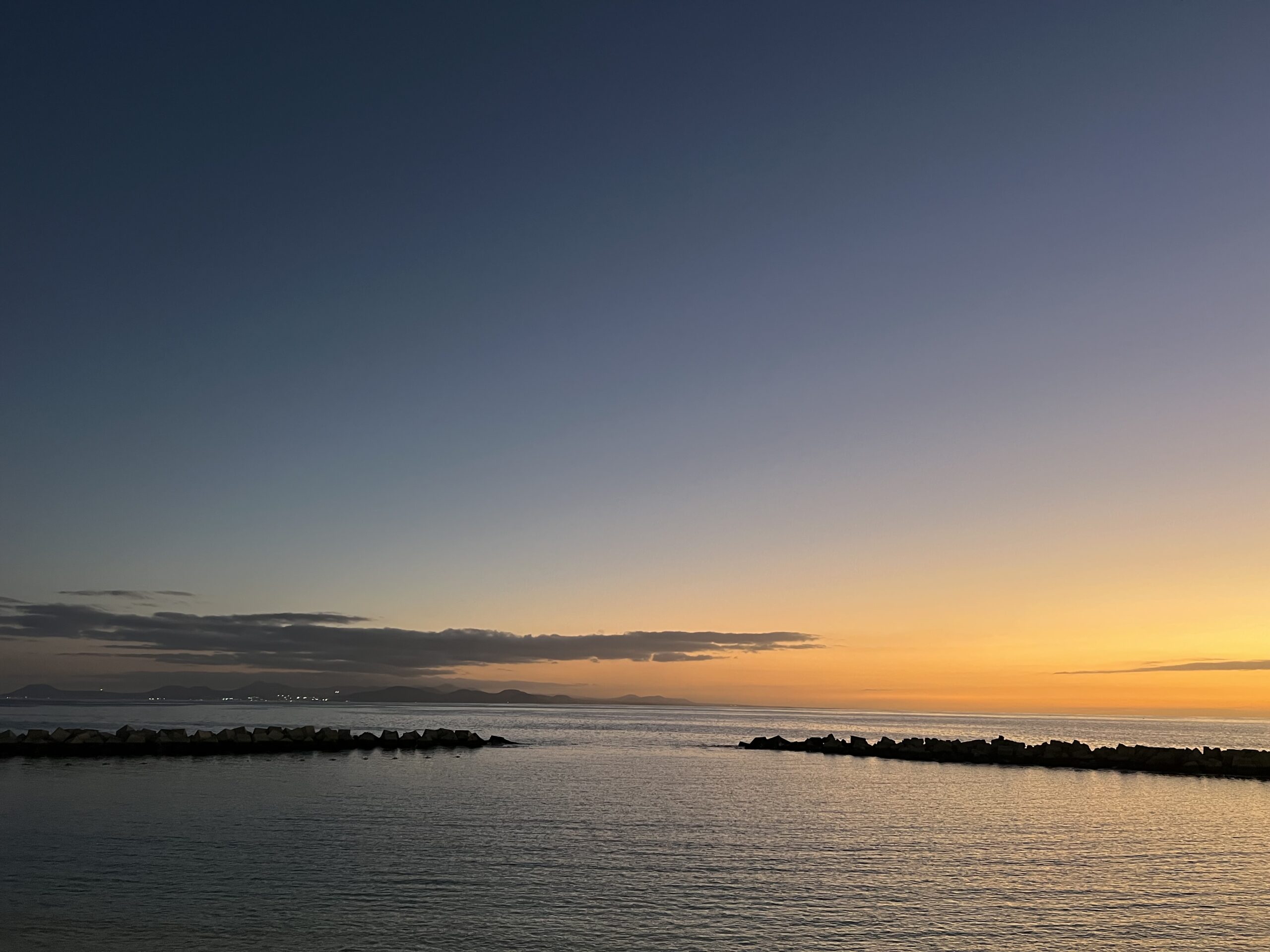 alt="calm water at sunset"