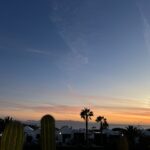 alt="sunset over the local rooftops"