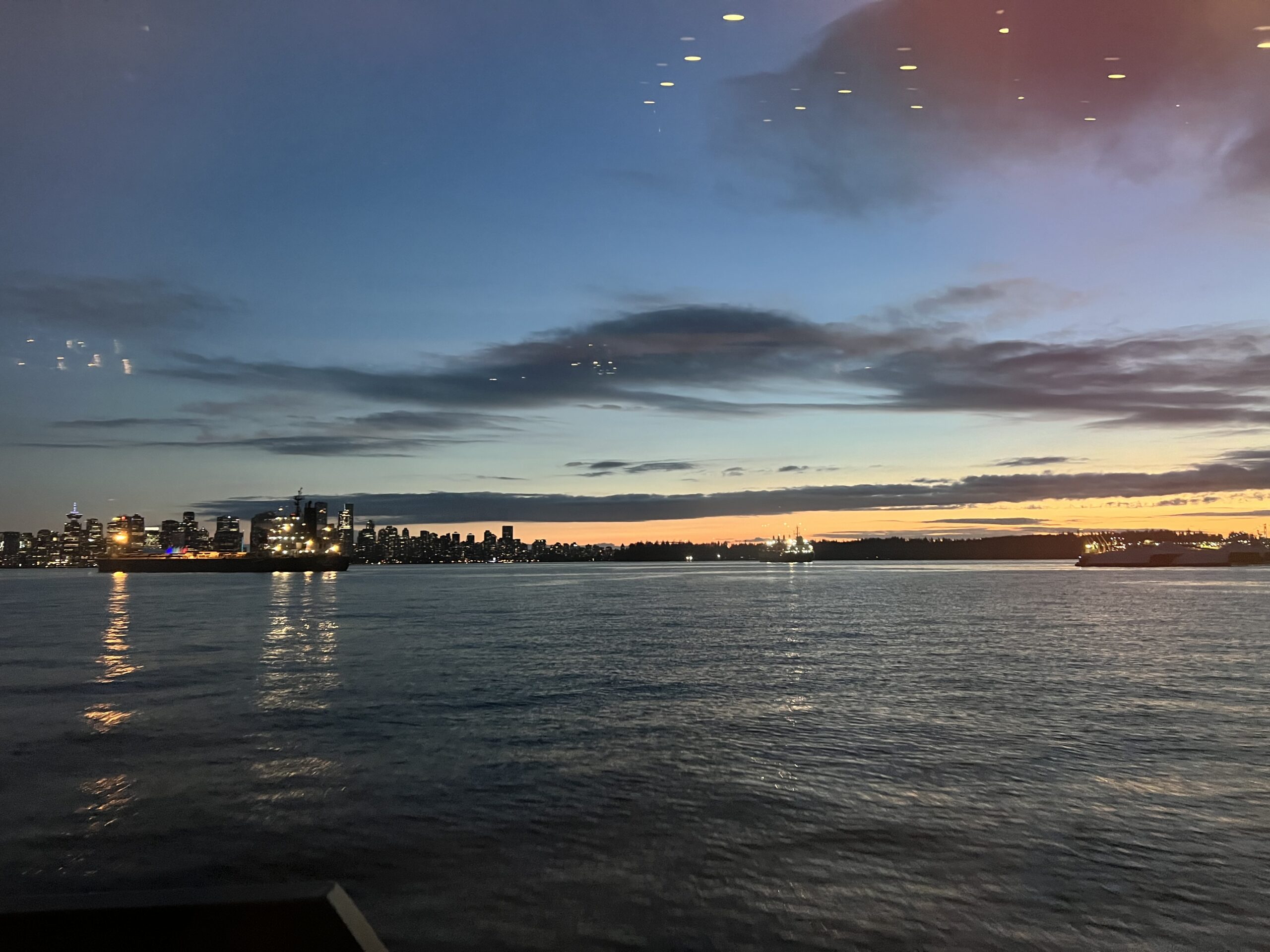 alt="sunset over the skyline of vancouver"